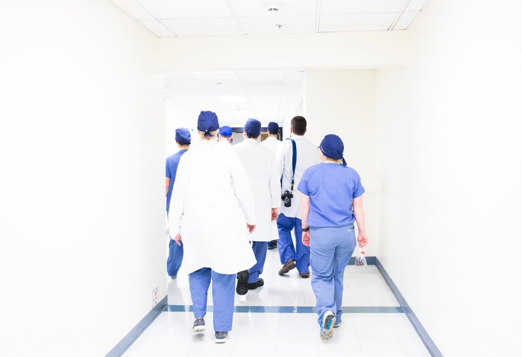 Doctors and nurses walking down the hospital corridor