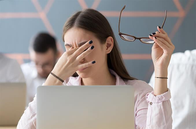 A girl during class looking exhausted and irritated